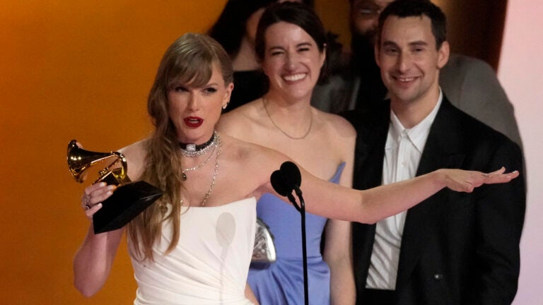 Taylor Swift accepts the award for album of the year for "Midnights."