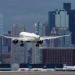 FILE - A JetBlue plane lands at Logan International Airport, Thursday, Jan. 26, 2023, in Boston.