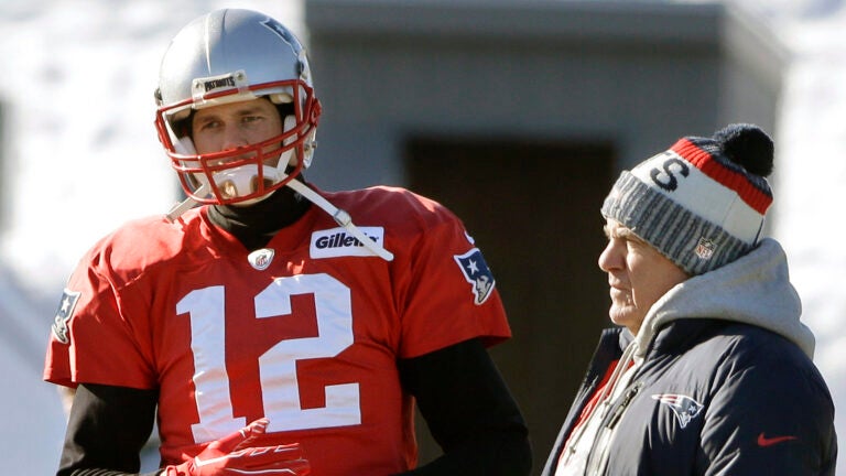 FILE - New England Patriots quarterback Tom Brady, left, stands with head coach Bill Belichick, right, during an NFL football practice, Thursday, Jan. 18, 2018, in Foxborough, Mass. Without Bill Belichick, Tom Brady won his seventh Super Bowl and is on pace to throw a career-high 53 touchdown passes at age 44. Without Brady under center, Belichick is 54-61 over his career, including 8-11 since the future Hall of Fame quarterback left New England for Tampa Bay.
