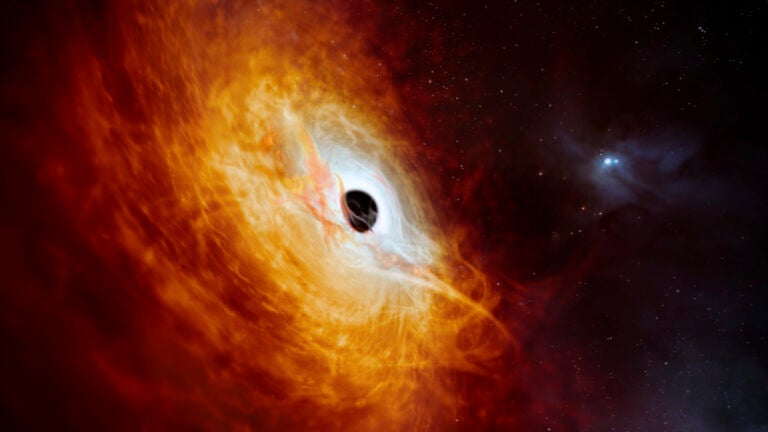 The supermassive black hole, pulling in surrounding matter.
