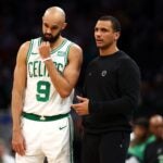 BOSTON, MASSACHUSETTS - JANUARY 10: Boston Celtics head coach Joe Mazzulla talks with Derrick White #9 of the Boston Celtics at TD Garden on January 10, 2024 in Boston, Massachusetts. The Celtics defeat the Timberwolves 127-120 in overtime.