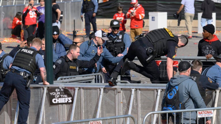 FILE - Law enforcement personnel clear the area around Union Station following a shooting at the Kansas City Chiefs Super Bowl celebration Feb. 14,