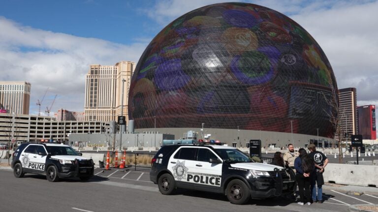 Individuals are seen in handcuffs near the Sphere after law enforcement responded to reports that pro-life activist Maison DesChamps (not pictured) had climbed to the top of the structure on February 07, 2024 in Las Vegas, Nevada.