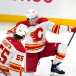 Calgary Flames forward Andrei Kuzmenko, rear, celebrates after his goal against the Bruins during the first period.