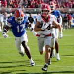Georgia wide receiver Ladd McConkey (84) runs past Florida linebacker Scooby Williams (17) to score a touchdown on a 41-yard pass play during the first half of an NCAA college football game, Saturday, Oct. 28, 2023, in Jacksonville, Fla.