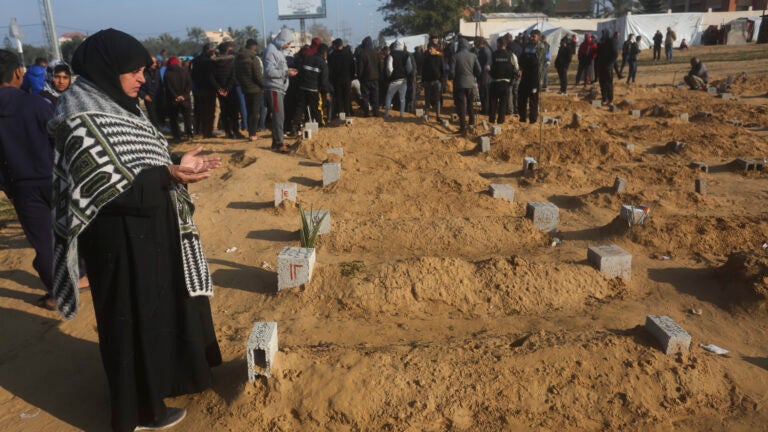 A Palestinian woman prays for a relative killed in the Israeli bombardment of the Gaza Strip.