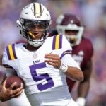 BATON ROUGE, LOUISIANA - NOVEMBER 25: Jayden Daniels #5 of the LSU Tigers runs with the ball during the first half against the Texas A&M Aggies at Tiger Stadium on November 25, 2023 in Baton Rouge, Louisiana.