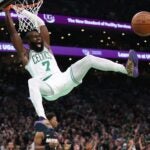 BOSTON, MASSACHUSETTS - OCTOBER 27: Jaylen Brown #7 of the Boston Celtics yells after a dunk during the second quarter against the Miami Heat at TD Garden on October 27, 2023 in Boston, Massachusetts.