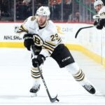 PHILADELPHIA, PENNSYLVANIA - JANUARY 27: Parker Wotherspoon #29 of the Boston Bruins skates with the puck during the third period against the Philadelphia Flyers at the Wells Fargo Center on January 27, 2024 in Philadelphia, Pennsylvania.