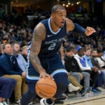 Memphis Grizzlies forward Xavier Tillman (2) handles the ball in the first half of an NBA basketball game against the Dallas Mavericks Monday, Oct. 30, 2023, in Memphis, Tenn.