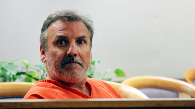 Brian Steven Smith sits in a courtroom.