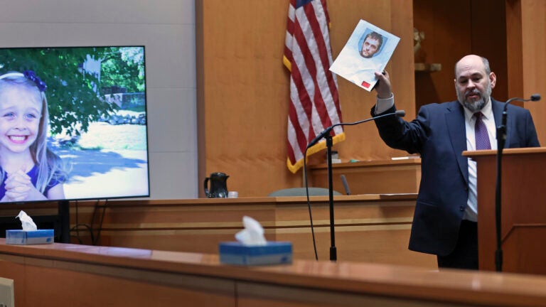 Senior Assistant New Hampshire Attorney General Benjamin Agati shows the jury a photograph of the defendant during closing arguments in Adam Montgomery's trial, Wednesday, Feb. 21, 2024, in Manchester, N.H.