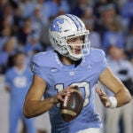 North Carolina quarterback Drake Maye (10) looks to pass during the first half an NCAA college football game against Virginia, Saturday, Oct. 21, 2023, in Chapel Hill, N.C.