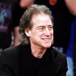 FILE - Comedian Richard Lewis attends an NBA basketball game in Los Angeles on Dec. 25, 2012.