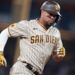 San Diego Padres' Xander Bogaerts runs the bases after hitting a home run during the ninth inning of a baseball game against the Los Angeles Dodgers, Monday, Sept. 11, 2023, in Los Angeles.