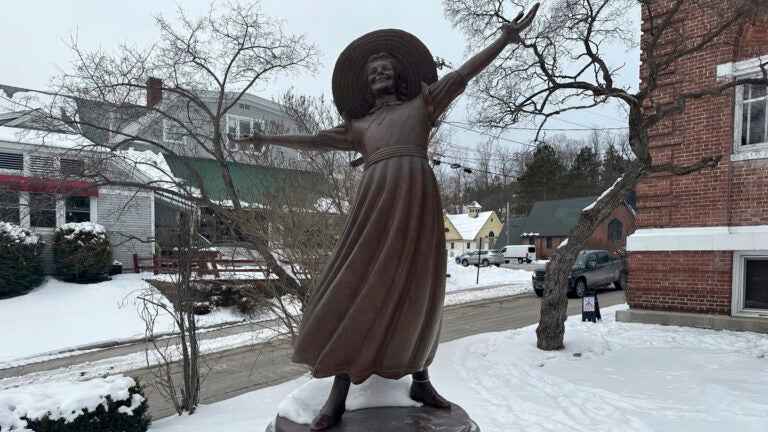 A bronze statue of Pollyanna sits outside the Littleton public library.