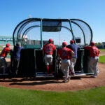 Red Sox catchers workout at batting practice during spring training in Fort Myers, Fla., Thursday, Feb. 15, 2024.