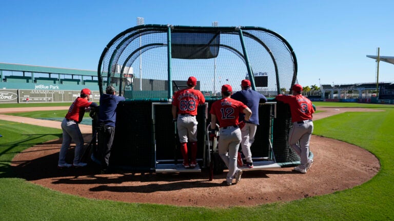 Red Sox catchers workout at batting practice during spring training in Fort Myers, Fla., Thursday, Feb. 15, 2024.