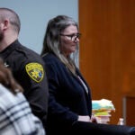 Jennifer Crumbley waits to be escorted from the Oakland County courtroom.