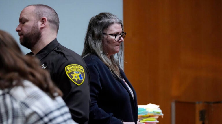 Jennifer Crumbley waits to be escorted from the Oakland County courtroom.