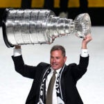 Vegas Golden Knights head coach Bruce Cassidy holds up the Stanley Cup after the Knights defeated the Florida Panthers 9-3 in Game 5 of the NHL hockey Stanley Cup Finals Tuesday, June 13, 2023, in Las Vegas. The Knights won the series 4-1.