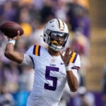 LSU quarterback Jayden Daniels (5) passes in the first half of an NCAA college football game against Texas A&M in Baton Rouge, La., Saturday, Nov. 25, 2023.
