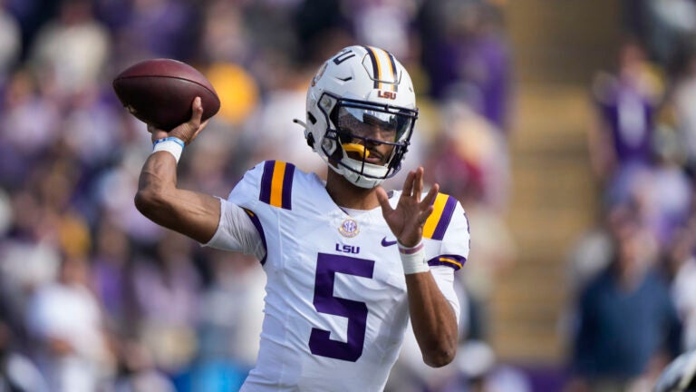 LSU quarterback Jayden Daniels (5) passes in the first half of an NCAA college football game against Texas A&M in Baton Rouge, La., Saturday, Nov. 25, 2023.