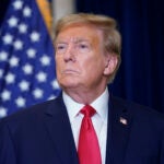 Former President Donald Trump speaks to the media at a Washington hotel.