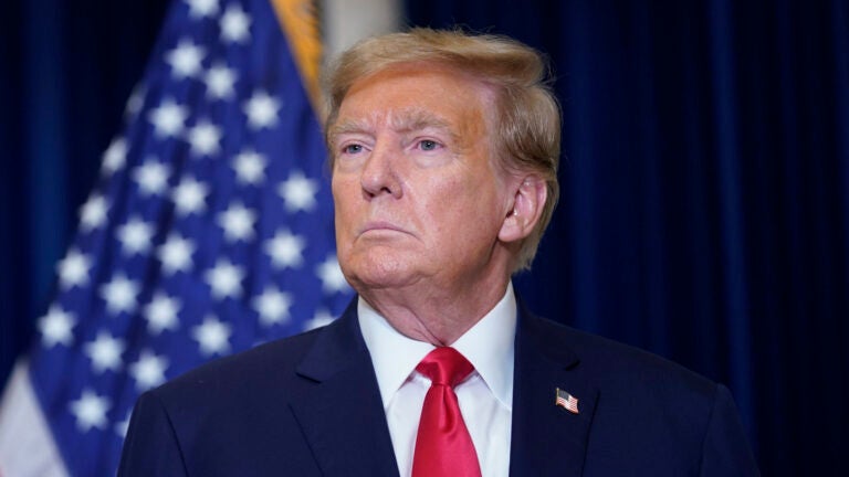 Former President Donald Trump speaks to the media at a Washington hotel.