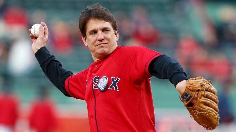 Boston Pops Orchestra conductor Keith Lockhart throws out the first pitch before a baseball game between the Boston Red Sox and the Houston Astros in Boston, Friday, April 26, 2013.