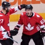 Team Canada center Brad Marchand (63) celebrates his game tying goal on Russia with teammates Alex Pietrangelo (27) and Patrice Bergeron (37) during the second period of a World Cup of Hockey semifinal game, Saturday, Sept. 24, 2016 in Toronto.