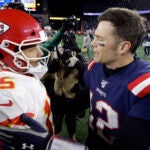 Kansas City Chiefs quarterback Patrick Mahomes, left, and New England Patriots quarterback Tom Brady speak at midfield after an NFL football game, Sunday, Dec. 8, 2019, in Foxborough, Mass.
