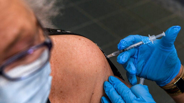 A Maryland resident receives a COVID-19 booster shot.