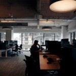An employee at their desk in an office in downtown Boston.
