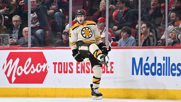MONTREAL, CANADA - MARCH 14: Jake DeBrusk #74 of the Boston Bruins celebrates his overtime goal against the Montreal Canadiens at the Bell Centre on March 14, 2024 in Montreal, Quebec, Canada. The Boston Bruins defeated the Montreal Canadiens 2-1 in overtime.