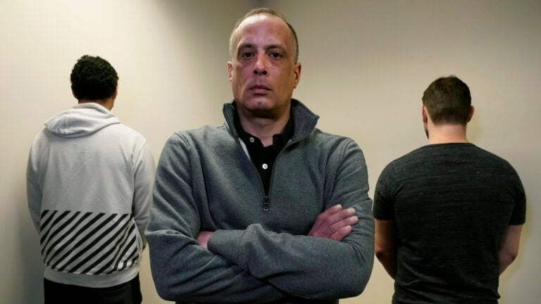 David Meehan, center, the lead plaintiff in a class-action lawsuit accusing the state of New Hampshire of covering up decades of sexual, physical and emotional abuse at its youth detention center, poses with two other victims.