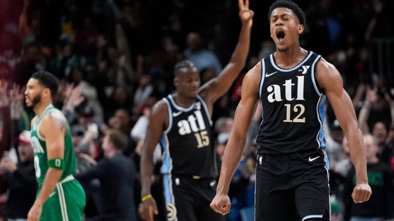 Atlanta Hawks forward De'Andre Hunter (12) reacts after hitting a three-point basket late in the second half.