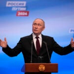 Russian President Vladimir Putin speaks on a visit to his campaign headquarters after a presidential election in Moscow.
