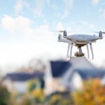 drone flying front of home insurance