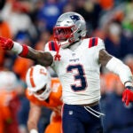 New England Patriots linebacker Mack Wilson Sr. (3) reacts after a defensive play in the first half at Empower Field at Mile High.