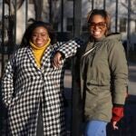 Chassity Coston and Charity Wallace pose outside Harvard Yard at Harvard University.
