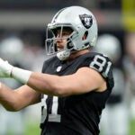 Las Vegas Raiders tight end Austin Hooper (81) warms up before an NFL football game against the Denver Broncos, Sunday, Jan. 7, 2024, in Las Vegas.
