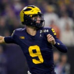 Michigan quarterback J.J. McCarthy passes against Washington during the first half of the national championship NCAA College Football Playoff game Monday, Jan. 8, 2024, in Houston.