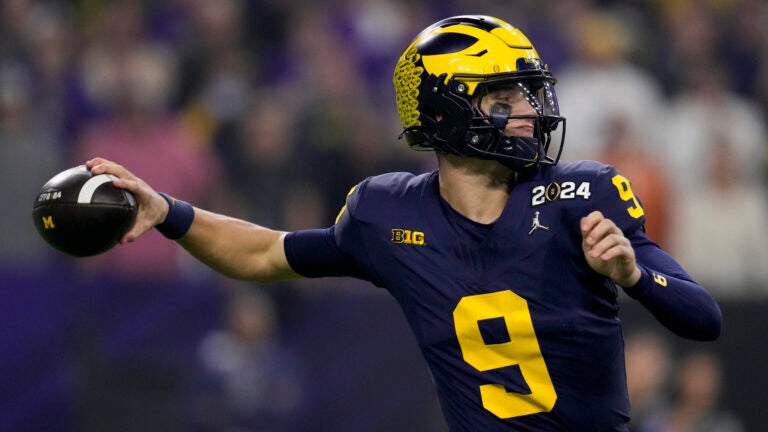 Michigan quarterback J.J. McCarthy passes against Washington during the first half of the national championship NCAA College Football Playoff game Monday, Jan. 8, 2024, in Houston.