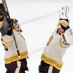 Boston Bruins' Linus Ullmark, left, and Jeremy Swayman celebrate after defeating the Montreal Canadiens in an NHL hockey game, Saturday, Jan 20, 2024, in Boston.