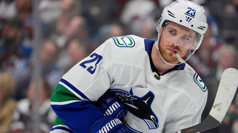 Vancouver Canucks center Elias Lindholm (23) in the third period of an NHL hockey game Tuesday, Feb. 20, 2024, in Denver.