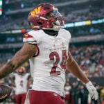 Washington Commanders running back Antonio Gibson (24) celebrates after scoring a touchdown during an NFL football game against the New York Jets on Sunday, Dec. 24, 2023, in East Rutherford, N.J.