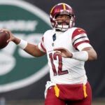 Washington Commanders quarterback Jacoby Brissett (12) in action against the New York Jets during an NFL football game on Sunday, Dec. 24, 2023, in East Rutherford, N.J.