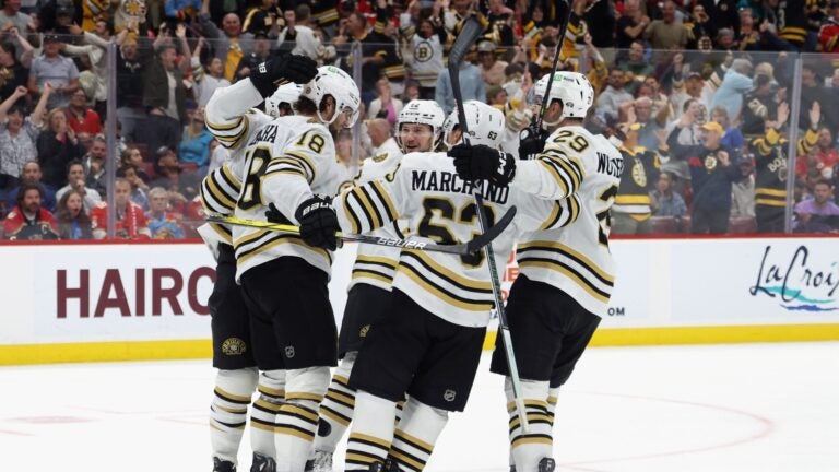 SUNRISE, FLORIDA - MARCH 26: The Boston Bruins celebrate the game-winning goal by Pavel Zacha #18 against the Florida Panthers at Amerant Bank Arena on March 26, 2024 in Sunrise, Florida.