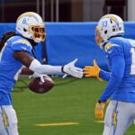 Los Angeles Chargers wide receivers Mike Williams (81) and Keenan Allen (13) celebrate in the end zone after Williams caught a pass for a touchdown during an NFL football game against the New York Jets, Sunday, November 22, 2020 in Inglewood, Calif. The Chargers defeated the Jets 34-28.